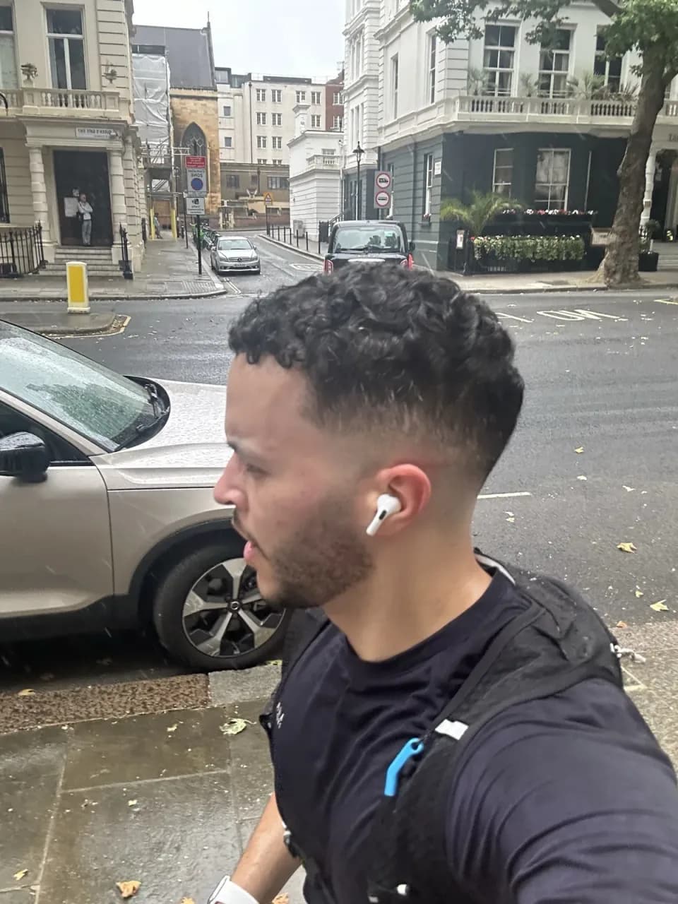 Elias mid-run on a rainy street in central London
